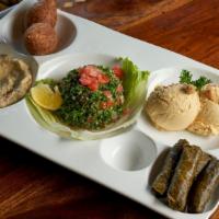 Layali Meat Combo · Hummus, falafel, baba ghanouj, meat grape leaves and tabbouleh salad and fried kibbe.