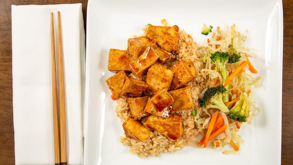 Tofu Teriyaki · Deep fried tofu glazed with teriyaki sauce, served with grilled mixed vegetables and steamed rice