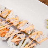 * Spicy Salmon Roll · Spicy. Raw salmon fish seasoned with spicy sauce, avocado, and crunchy flakes with spicy may...