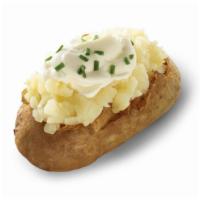 Sour Cream And Chive Baked Potato · A hot, fluffy potato topped with the classic combination of chives, and sour cream. It’s a s...