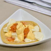 Quesillo (Melted Cheese On A Tortilla) · Served with Diced Onions and Crema.
