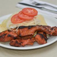 Cerdo Asado (Marinated Charbroiled Pork) · Includes 2 sides and Coleslaw.