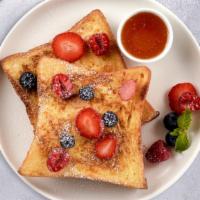 Pink Berry Cream French Toast · 2 slices of French Toast with strawberry cream cheese and topped with fresh strawberries.