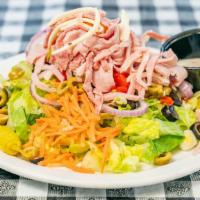 Italian Antipasto Salad · Genoa salami, ham and provolone served on a bed of lettuce with tomatoes, green olives, carr...