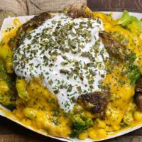 Jumbo Loaded Steak Potato  · Loaded with broccoli cheese sour cream corn sautéed seasoned New York strip steak  in carame...