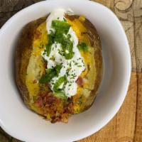Loaded Bake Potato  · Loaded with Sour cream bacon butter and cheese