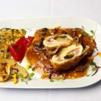 Pollo Valdostana · Breast of chicken filled with fontina cheese and prosciutto served in a marsala and mushroom...