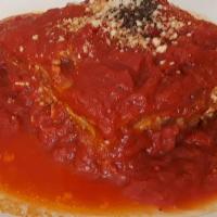 Lasagna Di Carne · Layers of pasta with homemade bolognese and bechamel sauce, basil, mozzarella, and pecorino ...