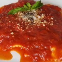 Ravioli Di Spinaci E Ricotta · Ravioli filled with ricotta cheese and spinach served in a fresh pomodoro sauce.