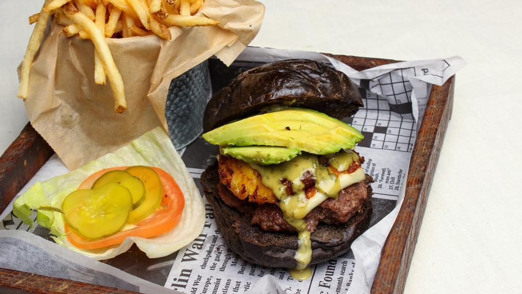 Caribe Burger · JSB beef patty, grilled white cheese, avocado, fried plantain, and our signature honey ginger tarragon sauce. Served with lettuce, tomato, pickles, and choice of side.