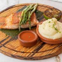 Grilled Salmon · Served with boniato and potato mash, grilled asparagus, and criolla sauce.