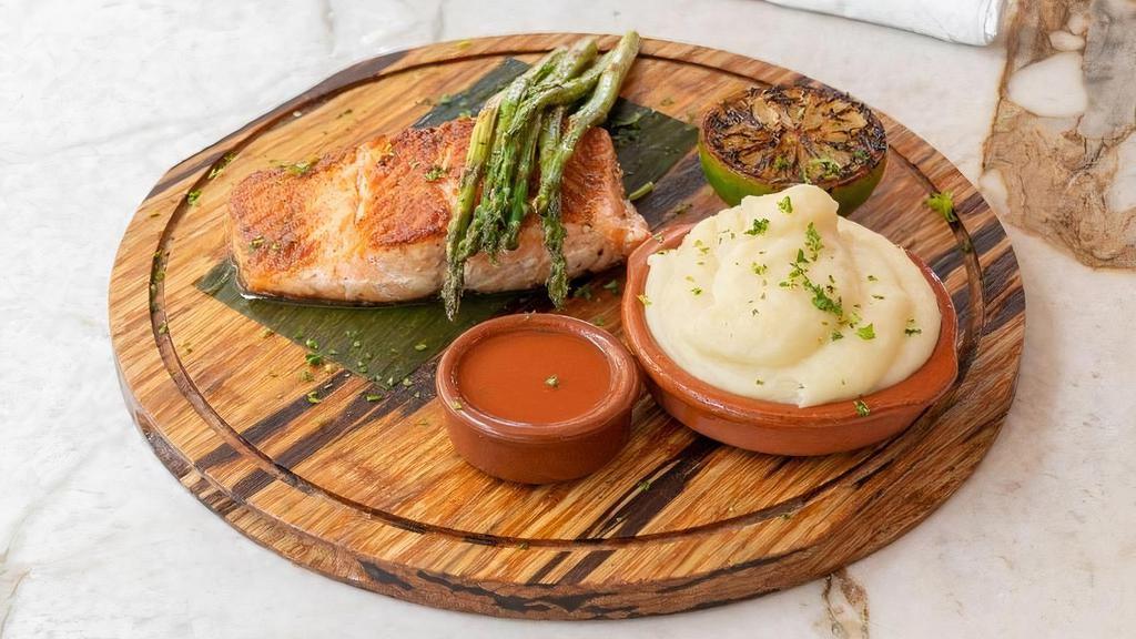 Grilled Salmon · Served with boniato and potato mash, grilled asparagus, and criolla sauce.