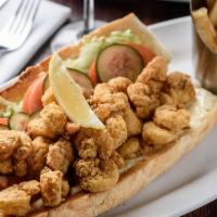 Shrimp Po Boy · Hand-battered, golden fried, dressed and served overstuffed. Served with french fries