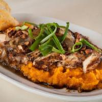 Grilled Chicken With Yams · Grilled chicken breast, mashed sweet potatoes, spiced pecans, and caramelized onions