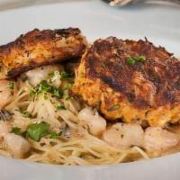 Crabcakes & Shrimp Alfredo - Broiled · Broiled Maryland style crabcakes,  sauteed Gulf shrimp served on angel hair pasta, topped wi...