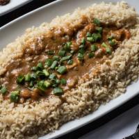 Crawfish Etouffée	 · Crawfish in a dark roux-based sauce, garlic, green onions, spices, ladled over steamed rice.