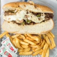 Philly Cheese Steak Sandwich · Served with fries.