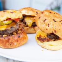 Camilla'S Sliders · Three mini burgers, cheddar, American, crispy onions, housemade ketchup, tucker sauce, tomat...