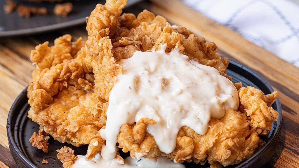 Lickin’ Good Chicken Fried Chicken · Buttermilk marinated chicken, dredged in seasoned flour, fried to a golden crisp and served with a peppery white gravy