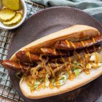 Bang Bang Seared Sausage Sandwich · Delicious grilled slabs of sausage with slaw, grilled onions, drizzled mustard sauce and BBQ...