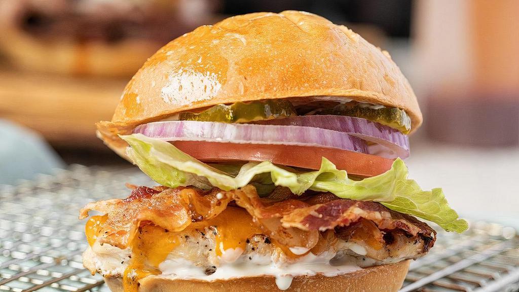 Mesquite Grilled Chicken Sandwich · Smokey mesquite grilled chicken topped with bacon, ranch, tomato, lettuce, onions and pickles on a toasted bun