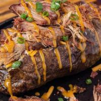  Pulled Pork Spud · Loaded with pulled pork tossed in our gold BBQ sauce