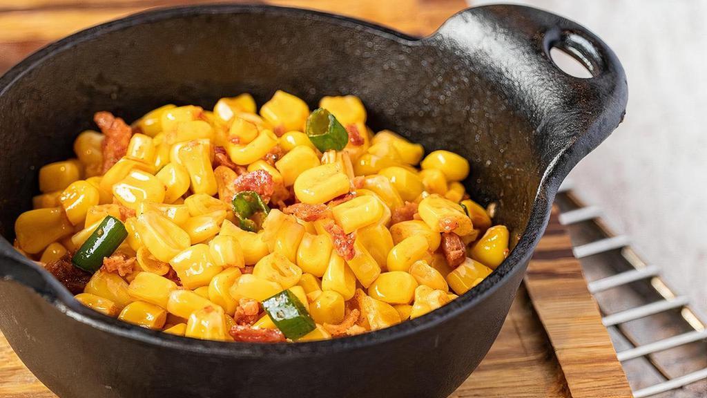Smokehouse Corn · Cut corn sauteed with bacon, onions and smoked paprika
