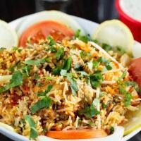 Chicken Biryani · Basmati rice cooked with chicken, herbs, Indian masala, and garnished with cilantro. Include...