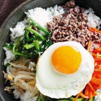 Bibimbap · Koreans adore this meal of rice topped with stir-fried mince, veggies and fried egg.