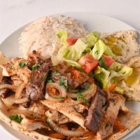 Mix Grill · Grilled chicken breast and marinated steak served with rice, salad and hummus.