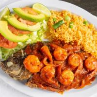 Mojarra A La Diabla · Deep fried tilapia with devil sauce and shrimp with rice and salad