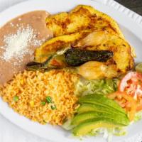 Pechuga A La Plancha · Grilled chicken breast accompanied by rice, beans and salad with an order of tortillas