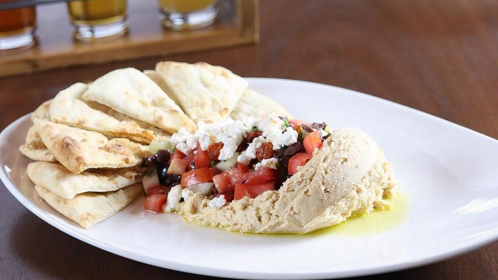 Hummus · olive cucumber tomato relish, feta cheese, smoky fried garbanzo beans, served with warm pita .