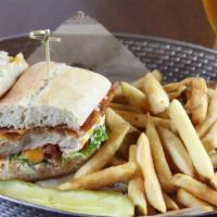 Grilled Chicken Sandwich  · lettuce, tomato, bacon, sharp cheddar cheese, roasted shallot black pepper aioli, served on ...