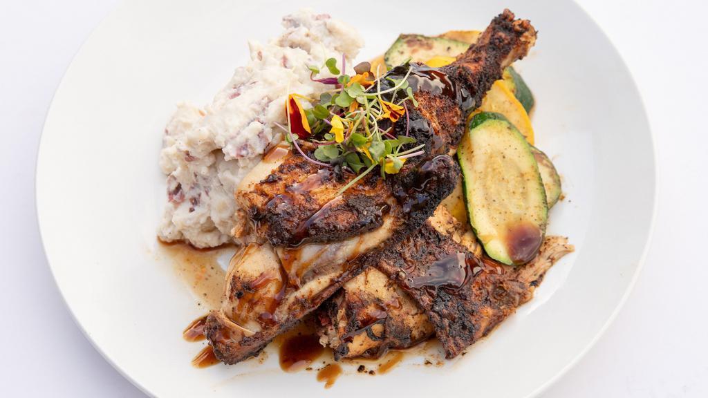 Roasted Chicken · Leg quarter finished with Demi glaze accompanied with garlic mashed potatoes and seasonal vegetables.