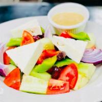 Greek Salad · Cucumbers, tomatoes, peppers, onions, olives, feta cheese, Greek vinaigrette, fresh lemon ju...