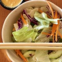 House Salad · With ginger dressing.