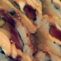 Nathan Roll (10) · Salmon, tuna, avocado, cream cheese, deep fried with spicy mayo and eel sauce. Raw.