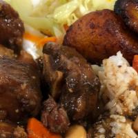 Oxtails · OXTAILS, CHOICE OF RICE, INCLUDES STEAMED VEGGIES AND PLANTAIN