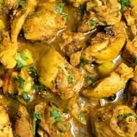 Curry Chicken · SERVED W/ CHOICE OF RICE, STEAMED CABBAGE & SWEET PLANTAINS