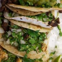 (4) Tacos Suaves De Carne О De Pollo · Soft corn beef or chicken, onions and cilantro.