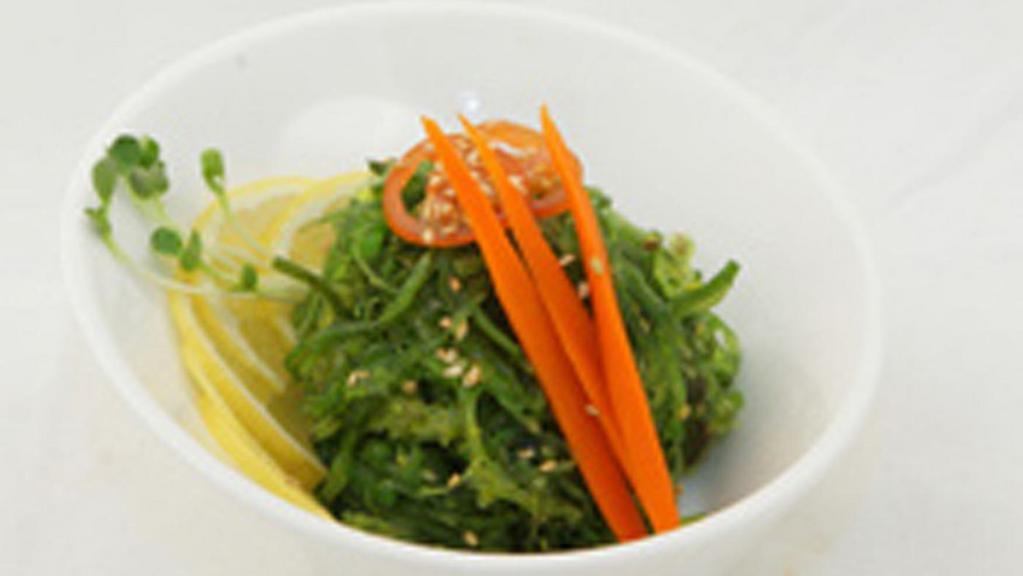 Seaweed Salad · Deep sea marinated seaweed on top of green salad
