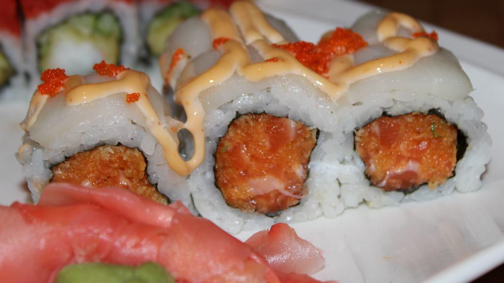 Crystal Roll · Spicy salmon and crunch inside w. escolar, spicy mayo, and fish eggs on top