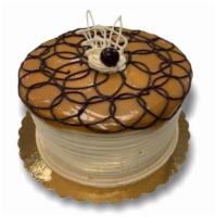 Dulce De Leche · This delicious sponge cake is filled and iced with Dulce de Leche Mousse decorated with Dulc...