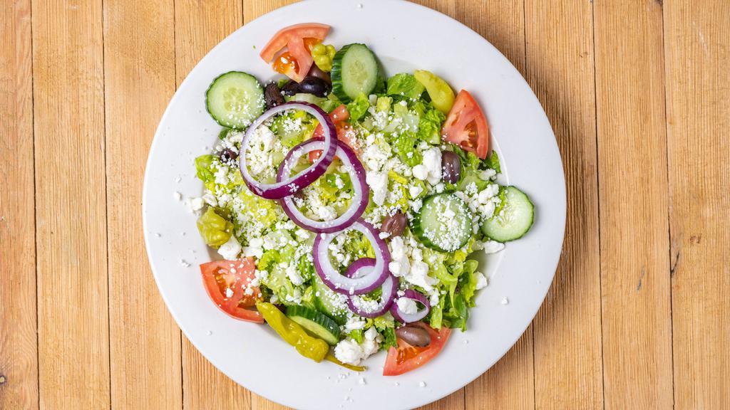 Greek Style Salad · Tomato, cucumber, red onion, Kalamata olives, feta cheese, romaine lettuce, Greek dressing.