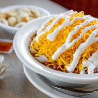 Loaded Chili Bowl · Our secret-recipe chili with beans and onions topped with shredded cheddar cheese and sour c...