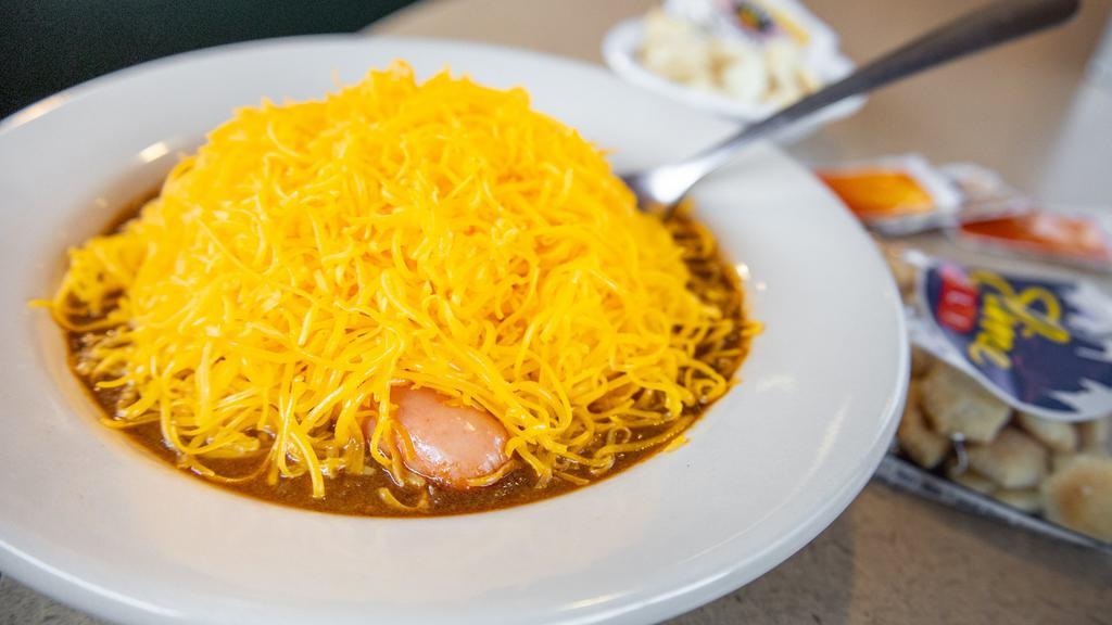 Coney Bowl · Three of our specially made hot dogs in a bowl of our secret-recipe chili topped with shredded cheddar cheese.