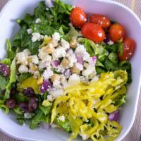 Side Greek Side Salad · Romaine lettuce, tomatoes, sliced pepperoncinis, feta cheese, kalamata olives and our origin...