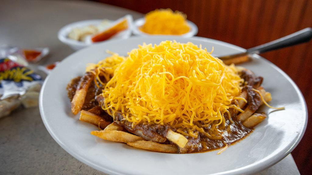 Chili Cheese Fries · Crispy French fries covered with our secret-recipe chili and shredded cheddar cheese.