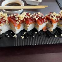Tokyo Roll · Shrimp Tempura, Cucumber, Avocado, Fresh Spicy Tuna, Fresh Tuna, Tempura Flakes, and Eel Sau...